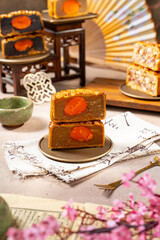 A mooncake is a traditional Chinese pastry that is typically eaten and gifted during the Mid-Autumn Festival, one of the biggest cultural celebrations in East and Southeast Asia
