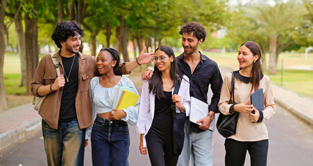 Indian happy young adult gen z walk female male man guys talk gossip share new day plan enjoy break time outdoor place. Happy pupil teen age girl boy group speak funny joke have fun joy park