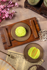 A mooncake is a traditional Chinese pastry that is typically eaten and gifted during the Mid-Autumn Festival, one of the biggest cultural celebrations in East and Southeast Asia
