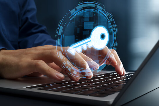 Encryption key management system and cryptography for cyber security. Passkey and secure passwordless authentication. Businessperson using laptop computer.