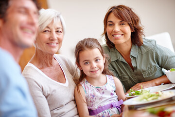 Smile, portrait and love with family at lunch for bonding, nutrition and thanksgiving event. Grandmother, girl and social gathering with dad in home with parents, celebration and brunch or meal