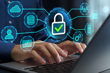 Network security and secure encrypted communication. Data protection. VPN and access control. Businessperson using laptop computer.