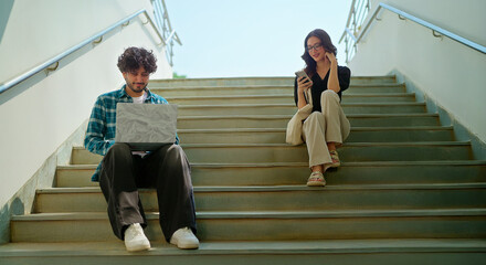 Indian young adult gen z busy male man use laptop look screen do study check online e work at...