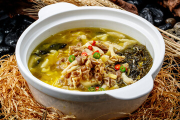 Sichuan peppercorn and sour soup with wood ear mushrooms and enoki mushrooms, and pork tripe.