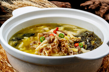 Sichuan peppercorn and sour soup with wood ear mushrooms and enoki mushrooms, and pork tripe.