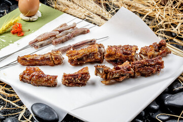 Jinzhou-style BBQ charcoal-grilled lamb penis and tail