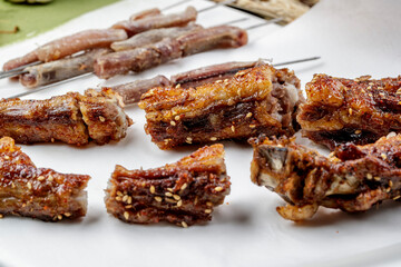 Jinzhou-style BBQ charcoal-grilled lamb penis and tail