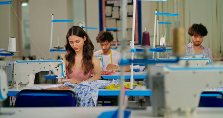 Indian young adult pupil gen z woman wear measure tape around neck sitting class room learn new...