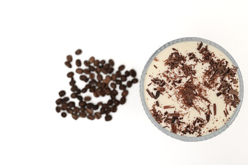 Delicious coffee ice cream dessert, tiramisu cake with whipped cream, on a white background, top view