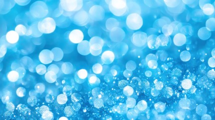 Abstract background of light blue bokeh circles.