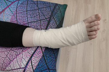 Sprained ankle, foot wrapped in bandage around the ankle joint