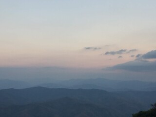 Mountain View in Early Morning with Fog and Sunrise
