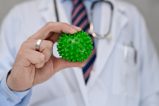 green medical ball with spikes for massage in physiotherapy