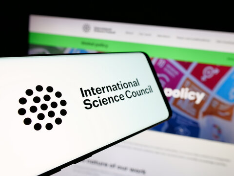Stuttgart, Germany - 11-23-2025: Smartphone with logo of International Science Council (ISC) on screen in front of website. Focus on center-left of phone display.