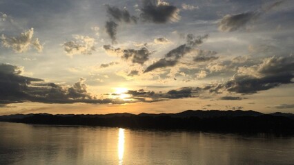Calm River with Mountains at Golden Hour