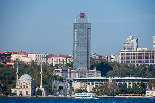 Istanbul, Turkey, October 20 2025; The Ritz-Carlton and Hilton Hotels Tower Over Dolmabah&ccedil;e and the Beşiktaş Waterfront with Vodafone Arena Visible in the Vibrant Metropolis.