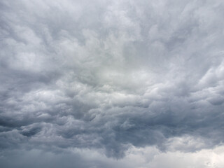 High resolution detailed background of deep grey and white dramatic storm clouds