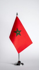 Moroccan flag on a stand, symbolizing national pride and identity.
