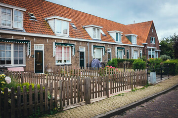 Traditional Dutch house with colorful wooden facade in Volendam fishing village, Netherlands architecture travel photo
