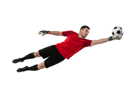 Soccer goalkeeper diving to catch ball in mid air on isolated background, athletic male making save with gloves and focused expression for sport training, competition and team defense concepts - Powered by Adobe