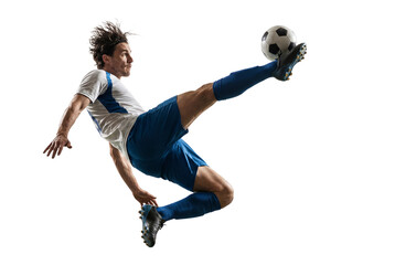 Fototapeta premium Male soccer player performing airborne kick with ball isolated on black, dynamic sports action for competition, coaching and fitness training concepts