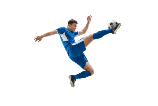 Male soccer player performing flying kick in midair on isolated black background, athletic action and competitive sports concept for training, fitness promotion and team spirit themes