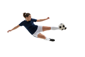 Female soccer player performing acrobatic volley kick in midair on isolated black background, athletic action and competitive sports concept for training, fitness motivation, and team promotion