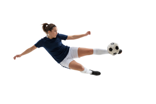 Female soccer player performing acrobatic volley kick in midair on isolated black background, athletic action and competitive sports concept for training, fitness motivation, and team promotion