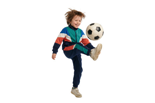 Happy child kicking soccer ball in mid air on isolated background, active youth sports and playful energy for school physical education and healthy lifestyle concepts