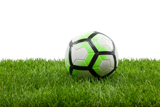 Soccer ball resting on green grass with copy space, close-up sports equipment concept for training, youth league and outdoor recreation on a clean white background