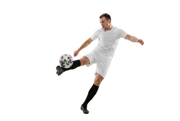 Fototapeta premium Male soccer player kicking ball in mid air on isolated background, athletic action and competitive sports concept for training, coaching materials and youth team promotion