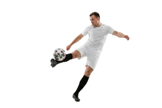Male soccer player kicking ball in mid air on isolated background, athletic action and competitive sports concept for training, coaching materials and youth team promotion