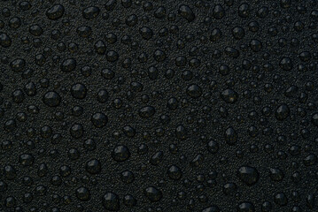 water drops on uniform plastic background