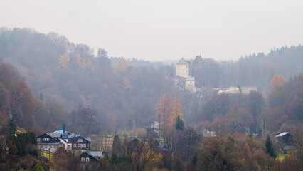 A magnificent view of Ojc&oacute;w Castle on a cloudy, foggy autumn day. Ojc&oacute;w National Park. Poland. Prądnik Valley.