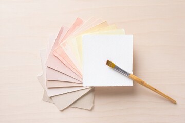 Selection of pastel colored paper sheets with a paintbrush