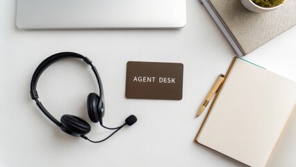 Overhead flat lay of headset and desk with agent card