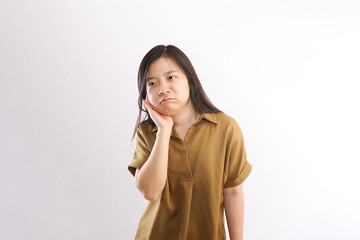 Fototapeta premium Sick Woman Compressing Her Face for Pain Relief on White Background