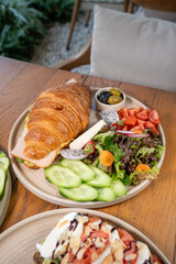 Delicious breakfast croissant sandwich filled with fresh ingredients