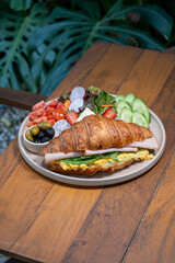 Delicious breakfast croissant sandwich filled with fresh ingredients
