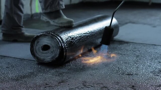 builders laying down waterproofing lino waterproofing floor area with people stock footage stock photo
