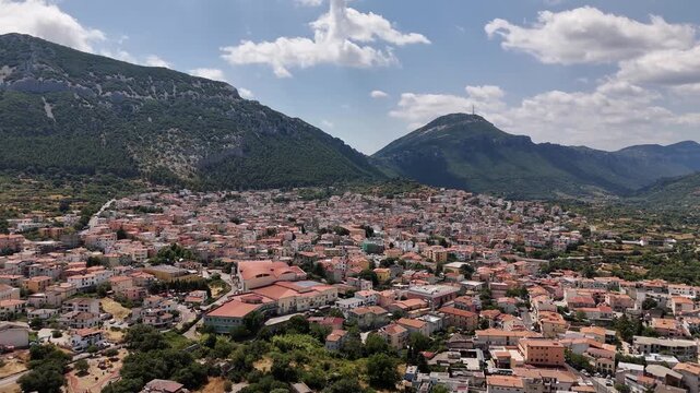 Aerial view of Dorgali, Sardegna with mountains and clouds
