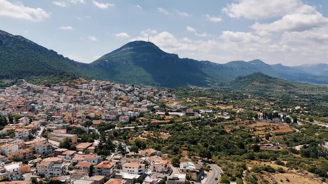 Dorgali town view with mountains, sunshine, and vast landscape in Sardegna
