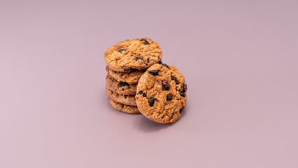 Close-up detail of the layered chocolate chips and the rough texture of the homemade cookies, conveying warmth and simple, sweet pleasure with room for text.
