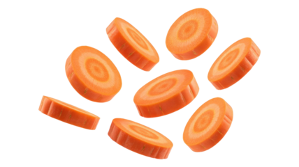 Eight vibrant orange carrot slices, freshly cut, appear to float or fall against a dark transparent background, showcasing their crisp texture and concentric rings. background removed