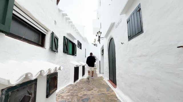 Walking through the village of Binibeca in Menorca