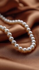 Pearl Necklace CloseUp on Luxurious Gold Satin Fabric, Elegant Jewelry Accessory for Women