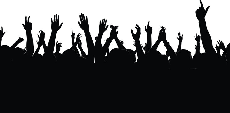 Silhouette of crowd with raised hands at concert or event