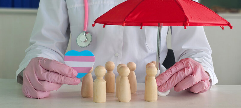 Doctor stands for health and safety with umbrella and heart symbol transgender lgbt