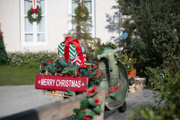 close-up, gifts with bow tie on motocycle rear of the motocycle have red sign with merry christmas text