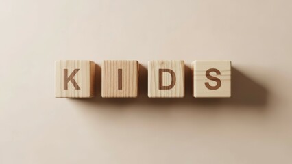 Obraz premium Four light brown wooden blocks with engraved letters K, I, D, S arranged to spell 'KIDS' on a smooth beige surface. Soft lighting creates subtle shadows, emphasizing childhood, learning and education.